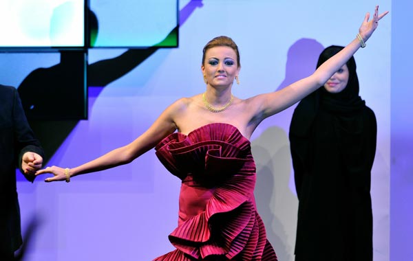 Actress Bushra celebrates on stage after winning the Best Actress award for "Six, Seven, Eight" during the Closing Night Muhr Awards Ceremony on day eight of the 7th Annual Dubai International Film Festival held at the Madinat Jumeriah Complex. (GETTY)