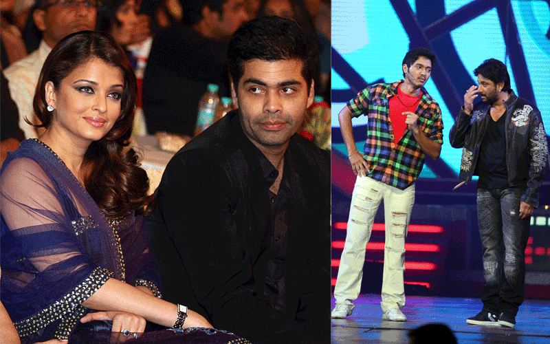 Indian Bollywood actress Aishwarya Rai Bachchan sits with film director Karan Johar and actors Shreyas Talpade and Arshad Warsi perform on the stage during the "Big Star Entertainment Awards" ceremony in Mumbai. (AFP)