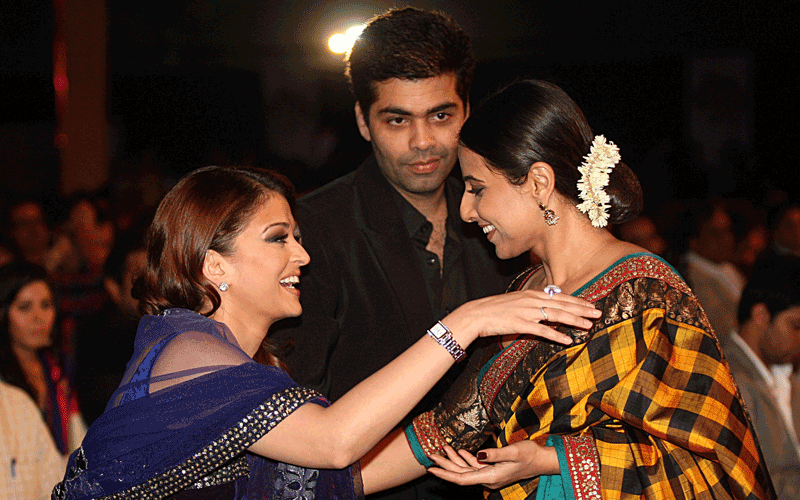 Indian Bollywood actress Aishwarya Rai Bachchan (L), director Karan Johar (C) and Vidya Balan attend the "Big Star Entertainment Awards" ceremony in Mumbai. (AFP)