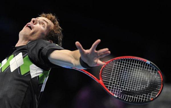 Britain's Andy Murray serves against Sweden's Robin Soderling in their singles match at the ATP World Tour Finals in London. (REUTERS)