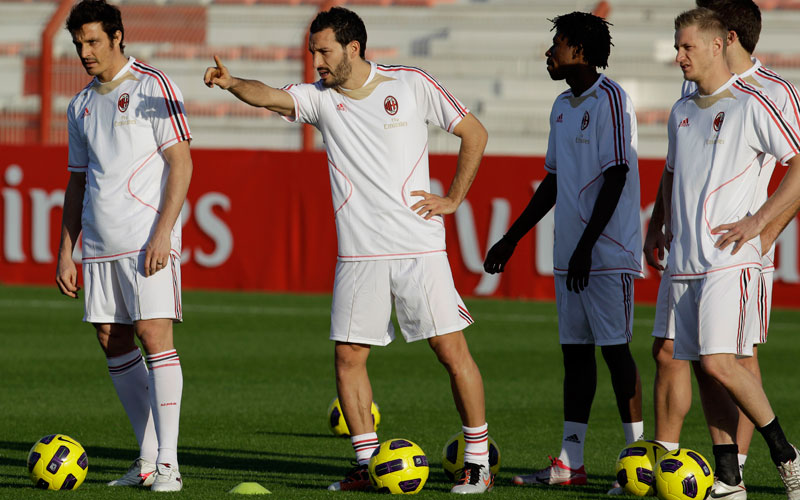AC Milan soccer player Gianluca Zambrotta , 2nd left, talks to his team mate during a training session in Al Ahli club in Dubai, United Arab Emirates. AC Milan will play against Al Ahli club in Dubai On Jan. 2, 2011. (AP)