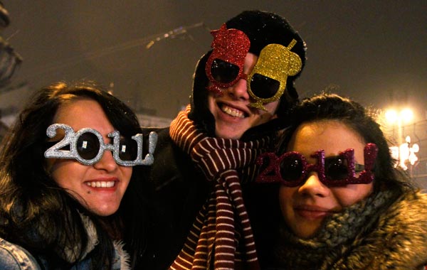 Revellers taking part in New Year celebrations pose for a photo in Budapes1. (REUTERS)