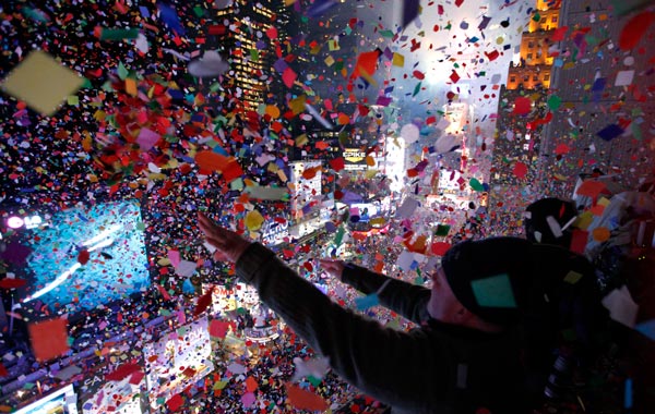 Confetti is dropped on revellers at midnight during New Year celebrations in Times Square in New York. (REUTERS)