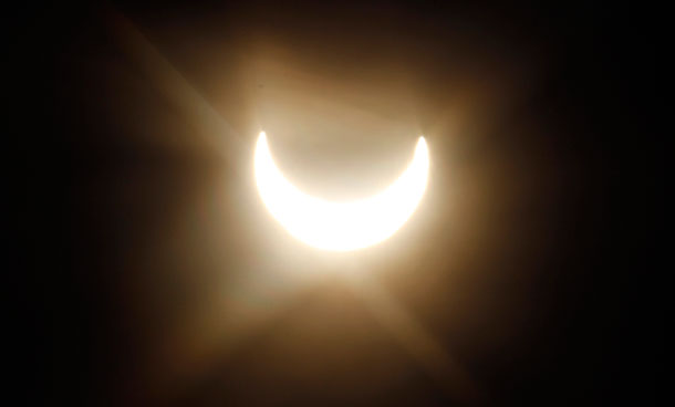 A partial solar eclipse is seen through the fog in Vienna, Austria, on Tuesday, Jan. 4, 2011. (AP)