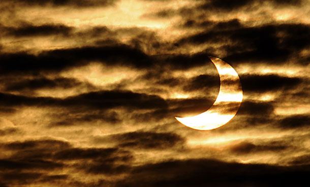 January 04, 2011 in Locon, northern France, shows the world's first partial solar eclipse of 2011. A solar eclipse happens when the Moon swings between the Earth and the Sun. (AFP)