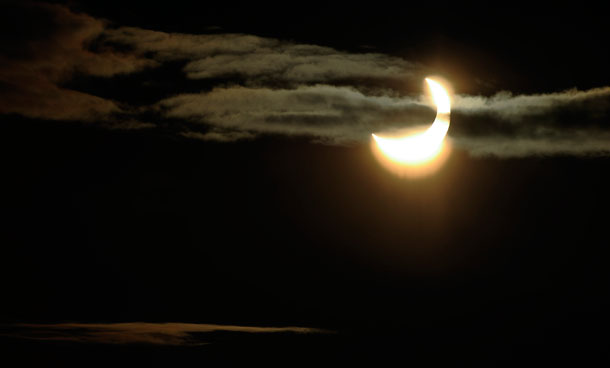 A partial solar eclipse is seen through clouds over Stockholm, Sweden, on Tuesday,Jan. 4, 2011. A sunrise eclipse was seen in Europe Tuesday morning, with the greatest eclipse expected over Sweden, where about 85 percent of the sun was to be blocked. (AP)