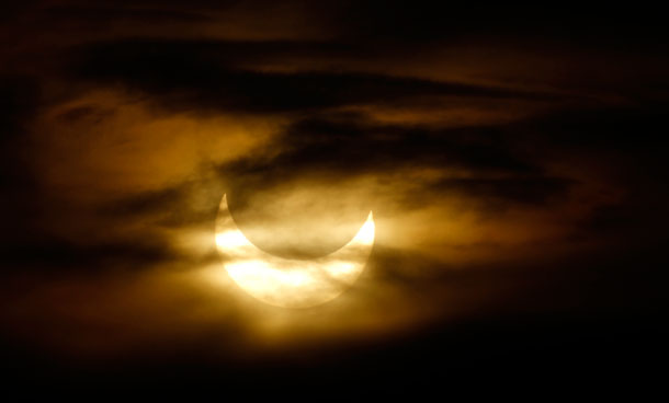 A partial solar eclipse is seen from Oberbuetschel, near Bern January 4, 2011. The partial eclipse was visible near sunrise over most of Europe and northeastern Asia on Tuesday. (REUTERS)
