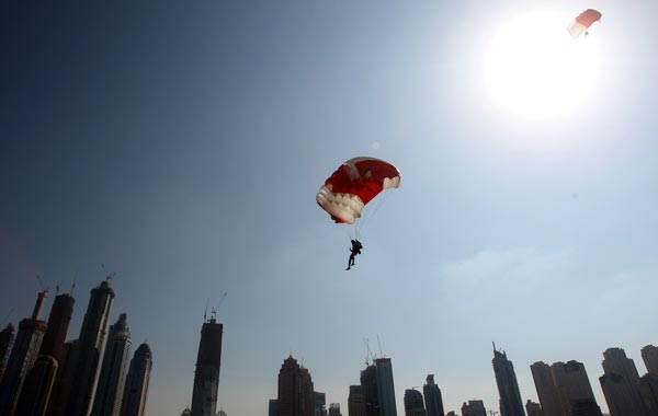 A member of the Bahraini team is pictured above Dubai's skyscrapers during the Gulf emirate's 2nd International Parachuting Championship and Gulf Cup 2011. (AFP)