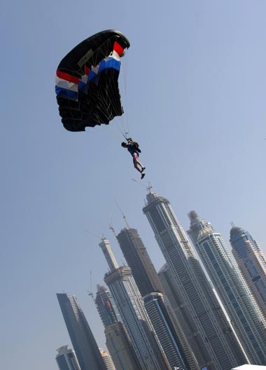A member of the Armee Francaise team is pictured above Dubai's skyscrapers during the Gulf emirate's 2nd International Parachuting Championship and Gulf Cup 2011. (AFP)
