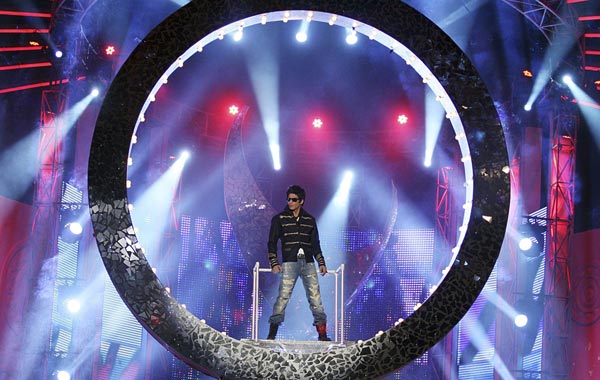 Indian Bollywood actor Shahrukh Khan performs on stage during the "Apsara Awards 2011" ceremony in Mumbai. (AFP)