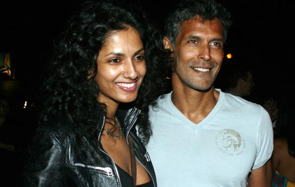 Indian Bollywood actor and model Milind Soman (R) and model Sheetal Malhar attend an ETRO Milano fashion show for the spring and summer 2011 men and women&rsquo;s collection at the Chivas Studio in Mumbai. (AFP)