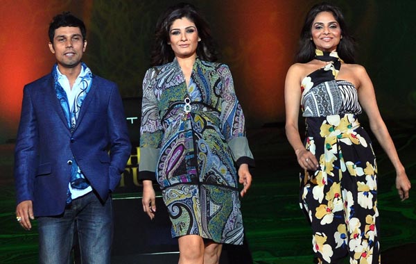 Indian Bollywood actor Randeep Hooda (L), actress Raveena Tandon (C) and Madhoo Shah (R) display creations by ETRO Milano on the runway for the spring and summer 2011 men and women&rsquo;s collection during a fashion event at the Chivas Studio in Mumbai. (AFP)