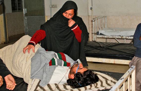 A Pakistani woman comforts a man who was shocked as a severe earthquake hit the area, in a hospital in Quetta, Pakistan. A major 7.2 magnitude earthquake rocked area of southwestern Pakistan early Wednesday, shaking many parts of the country and causing tremors as far away as India and the United Arab Emirates.(AP)