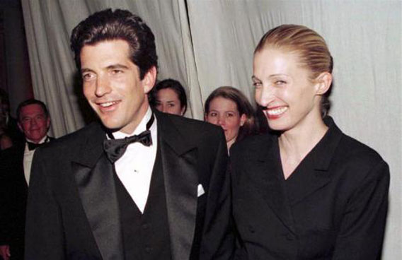 John F. Kennedy Jr. and his wife Carolyn Bessette stop for photographers at a gala dinner in New York, March 4, 1997. (REUTERS)