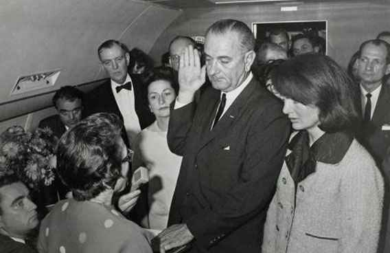 Vice President Lyndon Baines Johnson takes the presidential oath of office from Judge Sarah T. Hughes as President John F. Kennedy's widow first lady Jacqueline Bouvier Kennedy stands at his side aboard Air Force One at Love Field in Dallas just two hours after Kennedy was shot, November 22, 1963. (REUTERS)