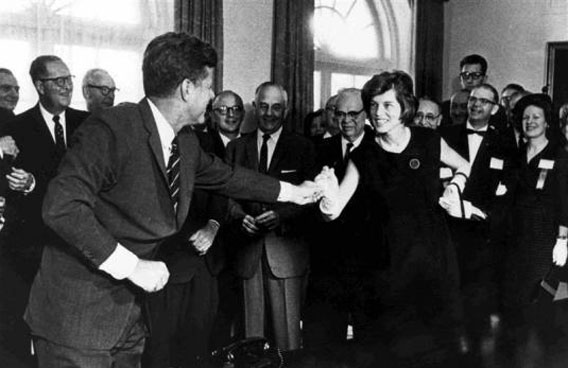 Eunice Kennedy Shriver is greeted by her brother during a bill signing at the White House in a file photo. (REUTERS)