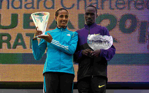 Aselefech Mergia Medessa of Ethiopia, left, winner of the women's marathon in a time of 2:22:45, and David Barmasai Tumo of Kenya, right, winner of the men's marathon in a time of 2:07:18 at the Dubai Marathon 2011, in Dubai on Friday, Jan. 21, 2011.  (AP)