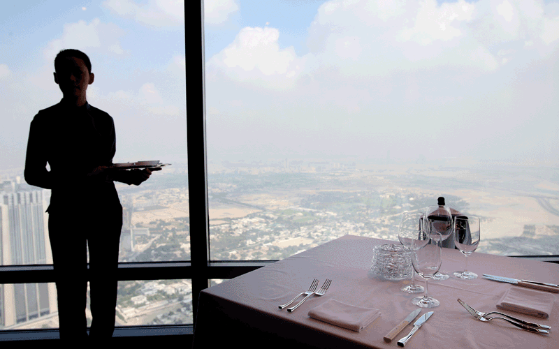 Wait staff at the 442-metre-high At.mosphere restaurant in Dubai's Burj Khalifa on January 23, 2011. The eatery features a spacious arrival lobby, a main dining floor, private dining rooms and display cooking stations (Patrick Castillo)