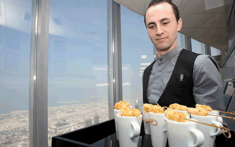A waiter at work during the opening of the world's highest restaurant, At.mosphere in Dubai's Burj Khalifa. The restaurant is now open for dinner only, but will commence service for lunch and tea in the coming weeks, officials told Emirates247.com (Patrick Castillo)