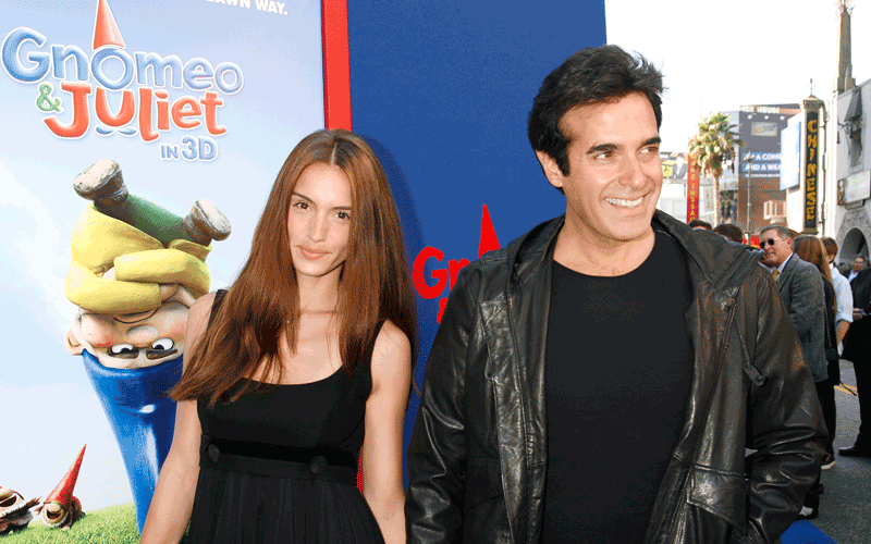 Magician David Copperfield (R) and a guest arrive at the premiere of Gnomeo & Juliet in Hollywood, California. (REUTERS)