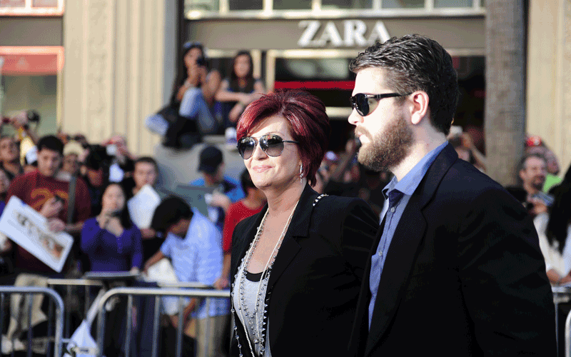 TV personalities Jack Osbourne (R) and Sharon Osbourne arrive at the world premiere of the animated Disney comedy adventure &ldquo;Gnomeo & Juliet," at the El Capitan Theatre in Hollywood, California. (AFP)