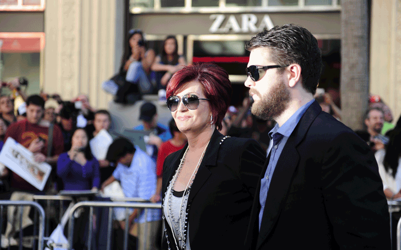 TV personalities Jack Osbourne (R) and Sharon Osbourne arrive at the world premiere of the animated Disney comedy adventure “Gnomeo & Juliet," at the El Capitan Theatre in Hollywood, California. (AFP)