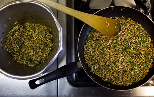Mealworms and spring onions are stir-fried to be used in a quiche at the Rijn IJssel school for Chefs in Wageningen January 12, 2011. To try and get wider support for their attempts to introduce insects on the menu of the top restaurants, scientists at the Wageningen University teamed up with the local cook academy.
Quiche with mealworms, springrolls with roasted grasshoppers and chocolate pralines with buffalo worms do not make ideal menu for housewarming parties, but in a few decades could be on dinner tables in many European countries as scientists seek ways to replace expensive meat. (REUTERS)