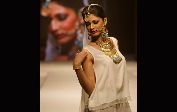 A Pakistani model displays jewelry created by Pakistani designer Shafaq Habeeb during the four-day Islamabad Fashion Week, in Islamabad, Pakistan. (AP)