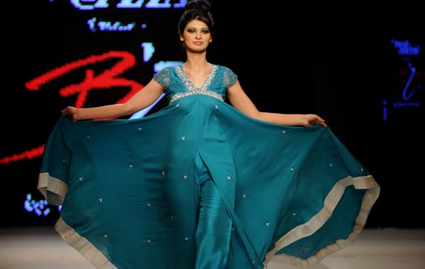 A Pakistani model presents a creation by Pakistani designer Bizma during the second day of Islamabad Fashion Week in Islamabad. (AFP)