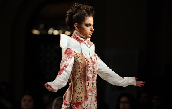 A Pakistani model presents a creation by Pakistan's School of Fine Art Design Gujranwala during the second day of Islamabad Fashion Week in Islamabad. (AFP)