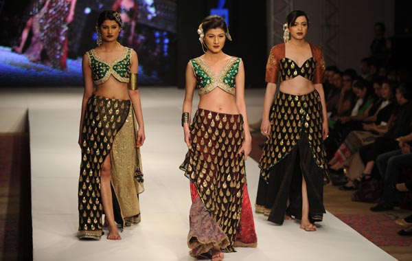 Pakistani models present creations by Pakistani designer Shaiyanne Malik during the third day of Islamabad Fashion Week in Islamabad. (AFP)