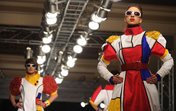 Pakistani models present creations by the Pakistani Iqra Fashion Institute during the third day of Islamabad Fashion Week in Islamabad. (AFP)