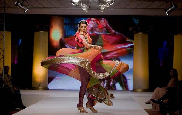 A Pakistani model presents a creation of a Pakistani designer Nilofer Shahid during the four-day Islamabad Fashion Week. (AP)