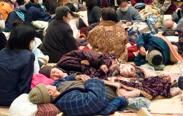 Local residents take a rest at a gymnasium acting as evecuation center in Takaharu town, Miyazaki prefecture. (REUTERS)