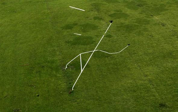 A set of rugby goal posts stand twisted by Cyclone Yasi in the northern Australian town of Tully. (REUTERS)