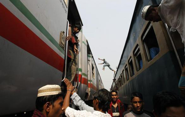 Commuters get off a train as it arrives at a station to attend the final prayer of Biswa Ijtema in Dhaka, Bangladesh. (REUTERS)