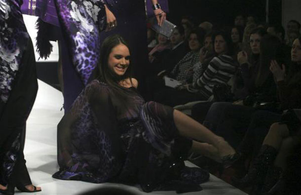 A model slips as she presents a creation by designer Emina Husadzinovic of Sarajevo during the last day of fashion week in Banja Luka. (REUTERS)