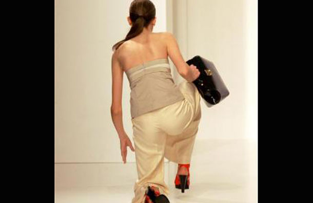 A model falls down during the fashion show trademark Forum, summer collection during the Sao Paulo Fashion Week in Sao Paulo. (REUTERS)