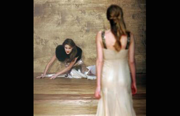 A model falls as she wears a creation by designer Amanda Wakeley at her autumn/winter 2006 show during London Fashion Week in London. (REUTERS)