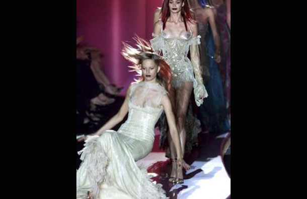 A model slips on her gown and falls to the catwalk at the end of Italian designer Donatella Versace's Autumn-Winter Haute Couture collection in Paris. (REUTERS)