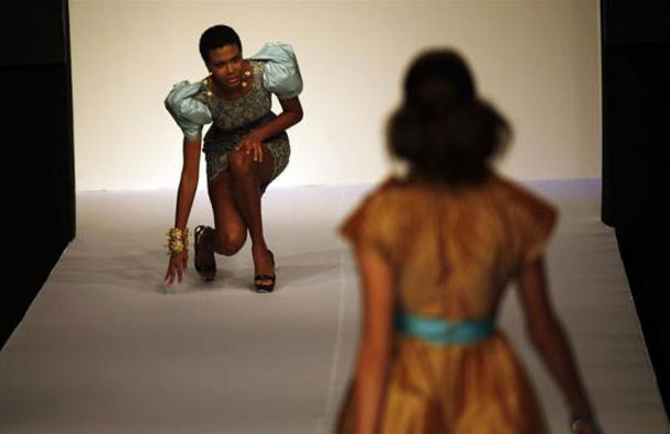 A model falls while presenting a creation from Mexican designer Alberto Rodriguez's spring/summer collection during a fashion show in Mexico City. (REUTERS)
