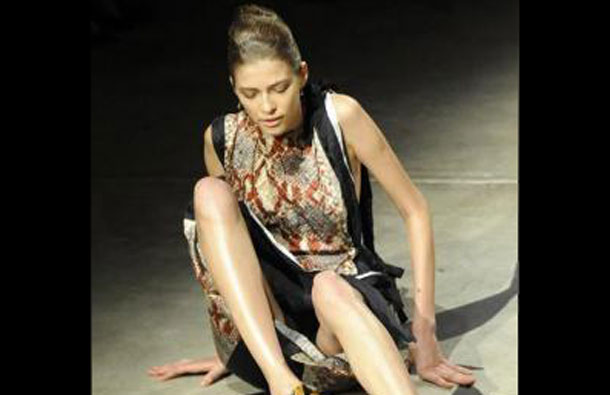 A model falls during Prada's Spring/Summer women's collection at Milan Fashion Week. (REUTERS)