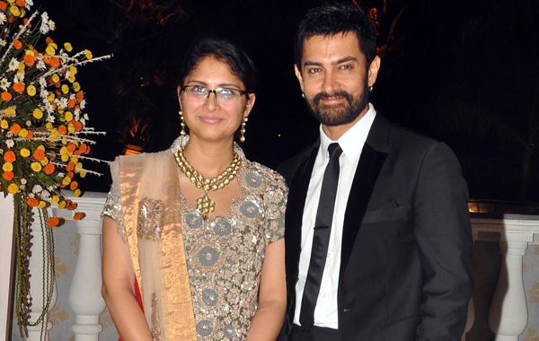 (FILE) Indian Bollywood actor Aamir Khan and director wife Kiran Rao (L) pose for photographs in Mumbai. (AFP)
