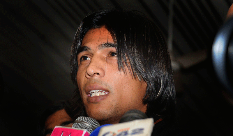 Pakistani cricketer Mohammad Aamer talks to media at the Allama Iqbal International airport upon his arrival from Doha, in Lahore on Tuesday. (AFP)