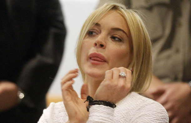 Lindsay Lohan listens during her arraignment after being charged with one count of felony grand theft for allegedly stealing a $2,500 necklace from a Venice Beach jewelry store, at the Airport Superior Court. The actress, who is on probation after completing a court-ordered spell in rehab for drug addiction, admits she took the necklace from a Venice Beach store but claims it was only on loan. The 24-year-old actress checked out of the Betty Ford clinic near Palm Springs last month, following a spell there after she was briefly jailed in September for failing a court-ordered drug test. A queen of Hollywood nights and a favorite target of the paparazzi, the former Disney child star was once considered one of the most promising actresses of her generation. (AFP)