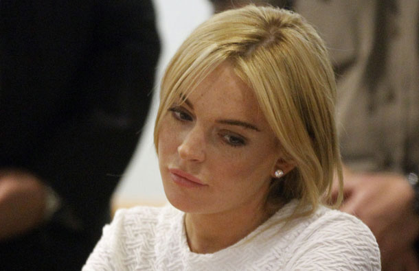 Lindsay Lohan listens during her arraignment after being charged with one count of felony grand theft for allegedly stealing a $2,500 necklace from a Venice Beach jewelry store, at the Airport Superior Court. (AFP)