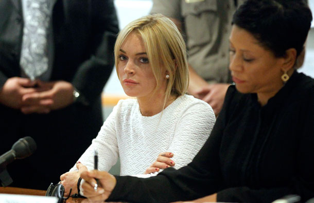 Actress Lindsay Lohan (L) and her attorney Shawn Chapman Holley appear in court as she pleads not guilty to a grand theft charge of stealing a $2,500 necklace from a jewelry store, in Los Angeles. Lohan is accused of walking out of a Los Angeles jewelry store without paying for a gold designer necklace in January - just three weeks after ending her fifth stint in drug and alcohol rehab in three years. (REUTERS)