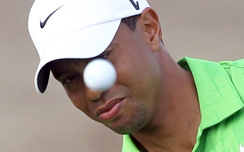 US golfer Tiger Woods plays a shot on the second day of the Dubai Desert Classic on Friday (AFP)