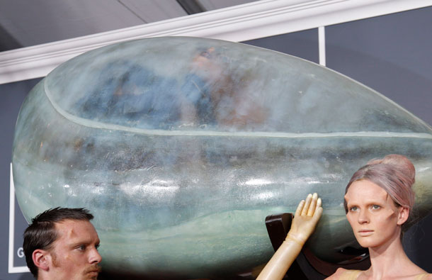 Lady Gaga, being carried in an egg-shaped vessel, arrives at the 53rd annual Grammy Awards in Los Angeles, California. (REUTERS)