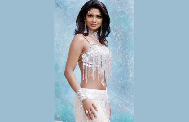 Bollywood star and former Miss World Priyanka Chopra poses for photographers prior to a dance shooting for the Indian movie "Plan", in Bombay July 9, 2003. (REUTERS)